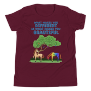 What makes you different is what makes you beautiful with two horses. Youth Small- XL